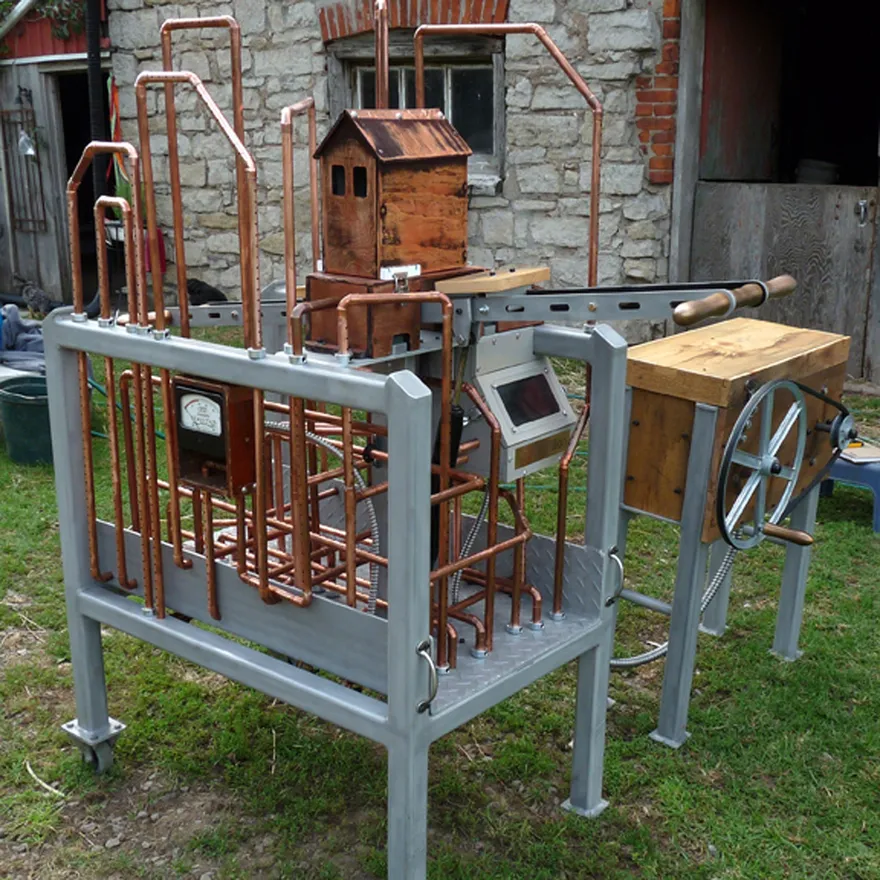 The Navitas sculpture — copper piping, wood, and aluminum forms studded with blue LEDs.