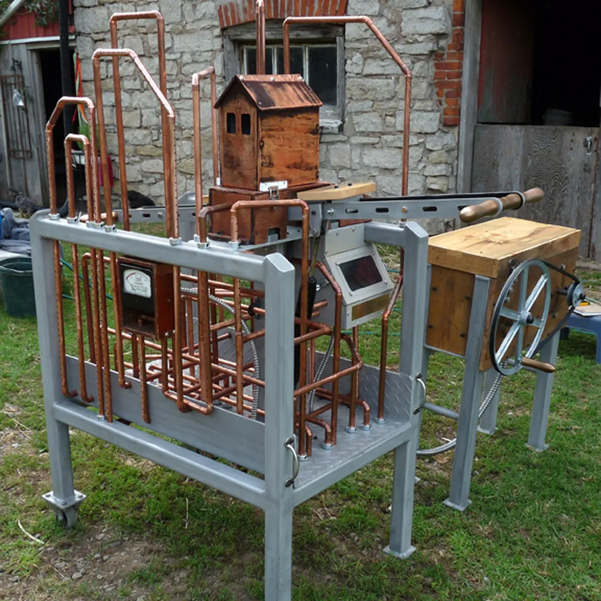Three-quarter view of the Navitas sculpture built from reclaimed copper, wood, and aluminum.